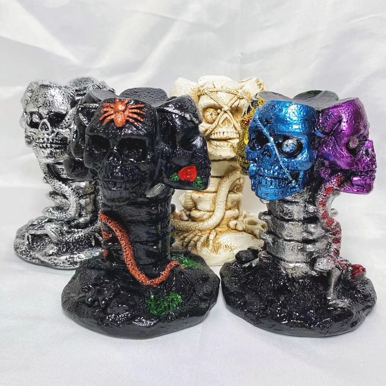 Resin four skulls sphere stand
