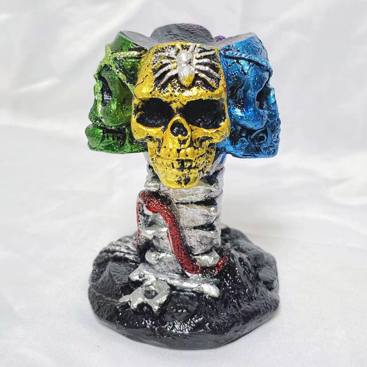 Resin four skulls sphere stand