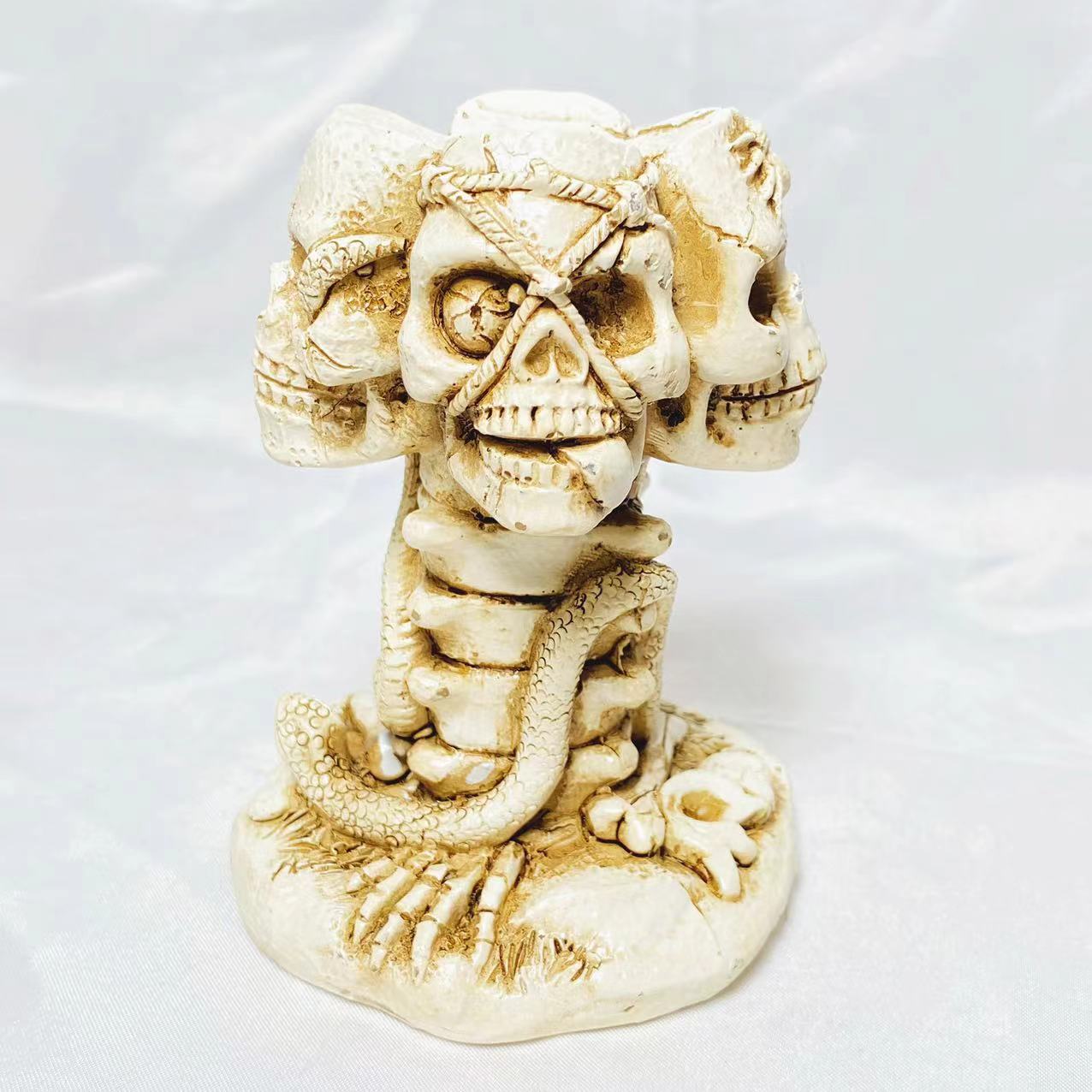 Resin four skulls sphere stand