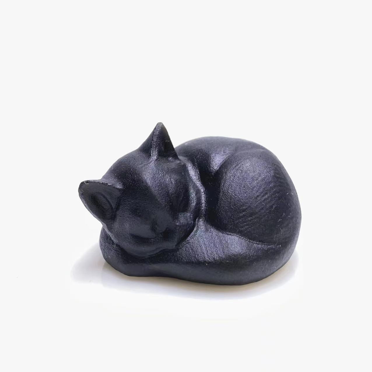 Black obsidian sleeping cat carving