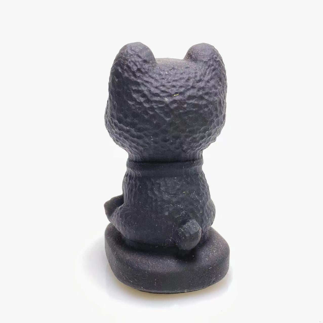 Black obsidian happy dog carving