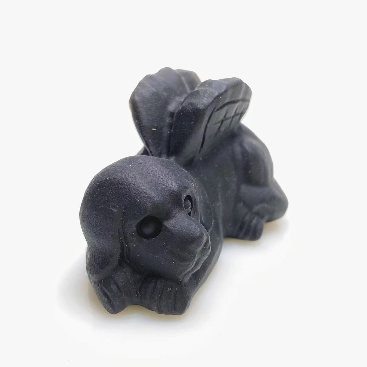 Black obsidian angel dog carving