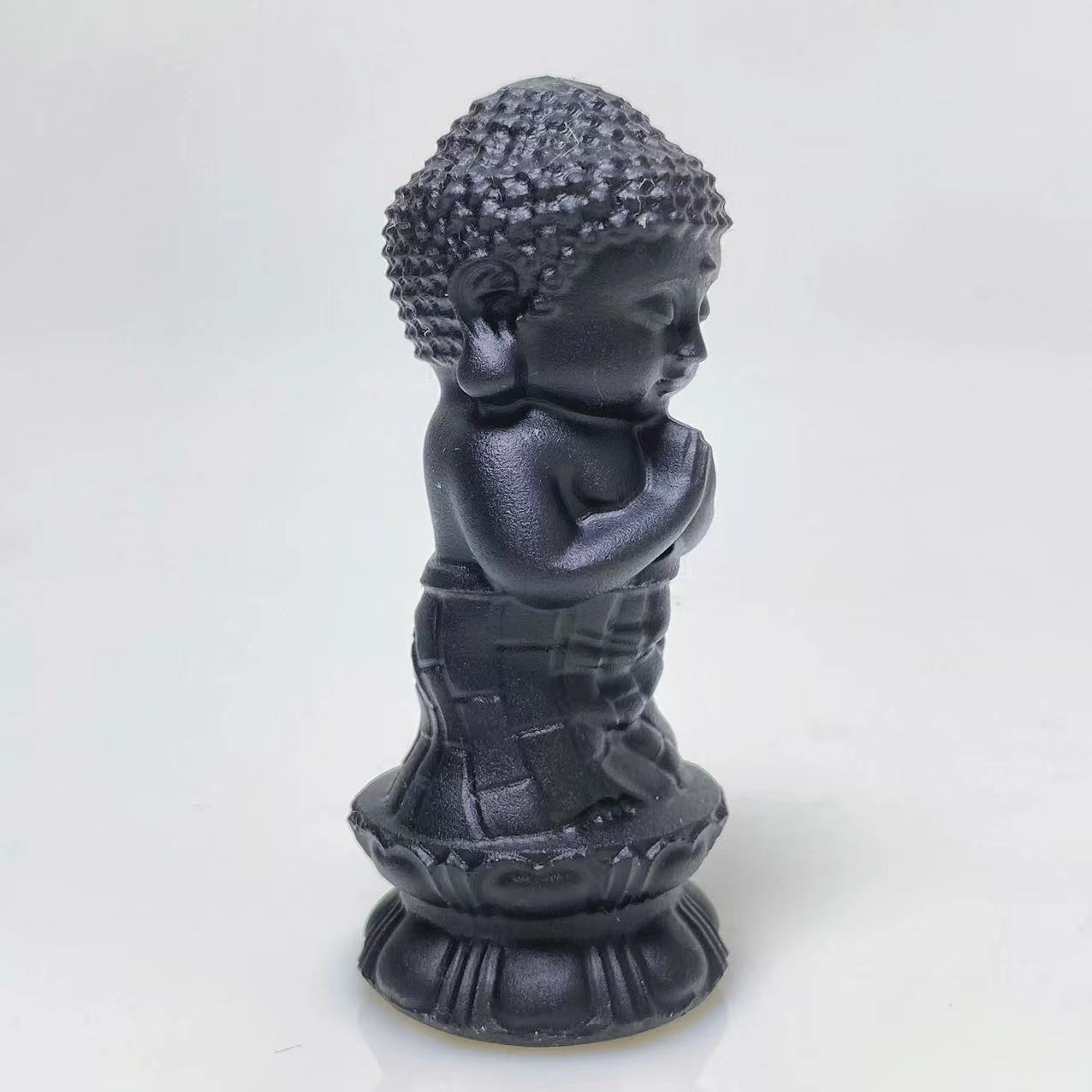 Black obsidian buddha on lotus carving