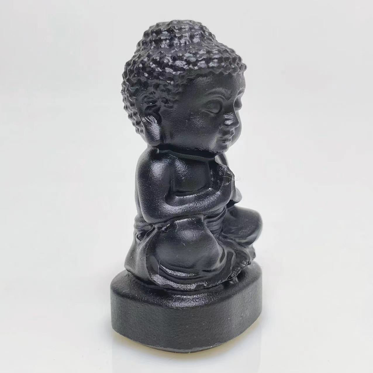 Black obsidian buddha sittig on lotus carving