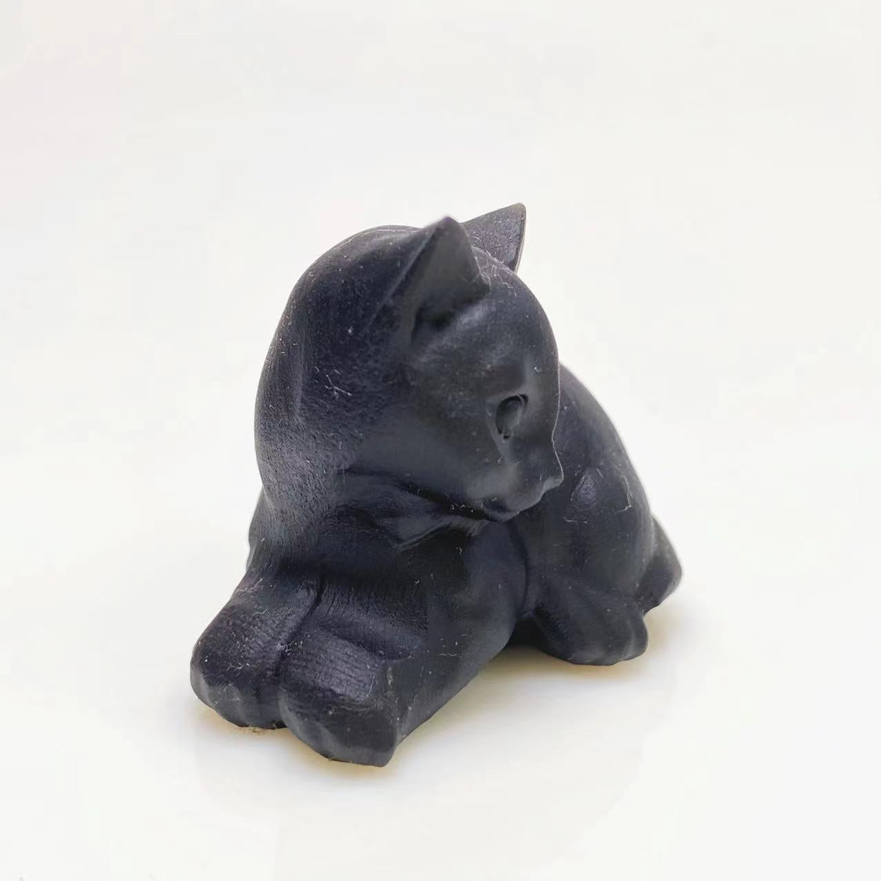 Black obsidian cat carving