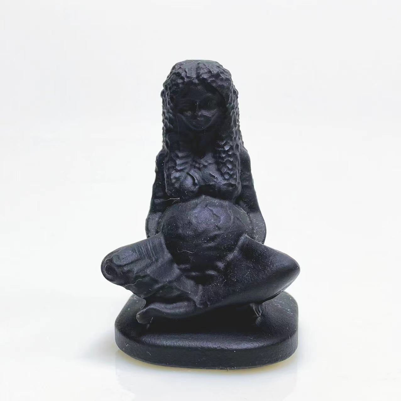 Black obsidian mother earth carving