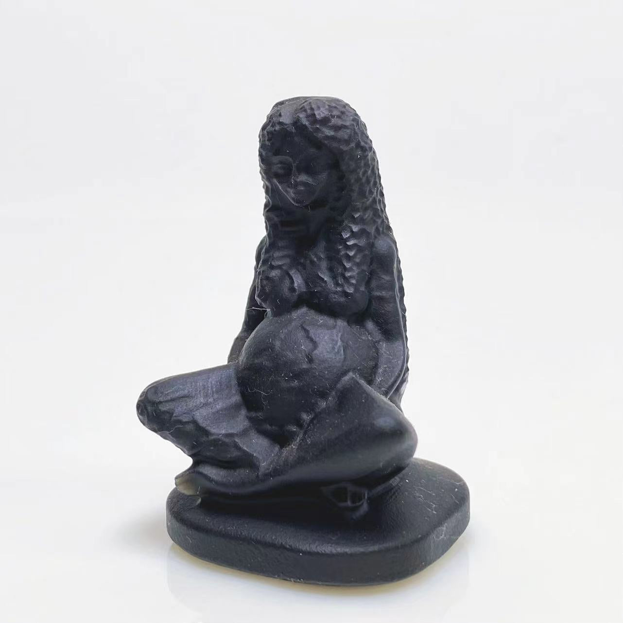 Black obsidian mother earth carving