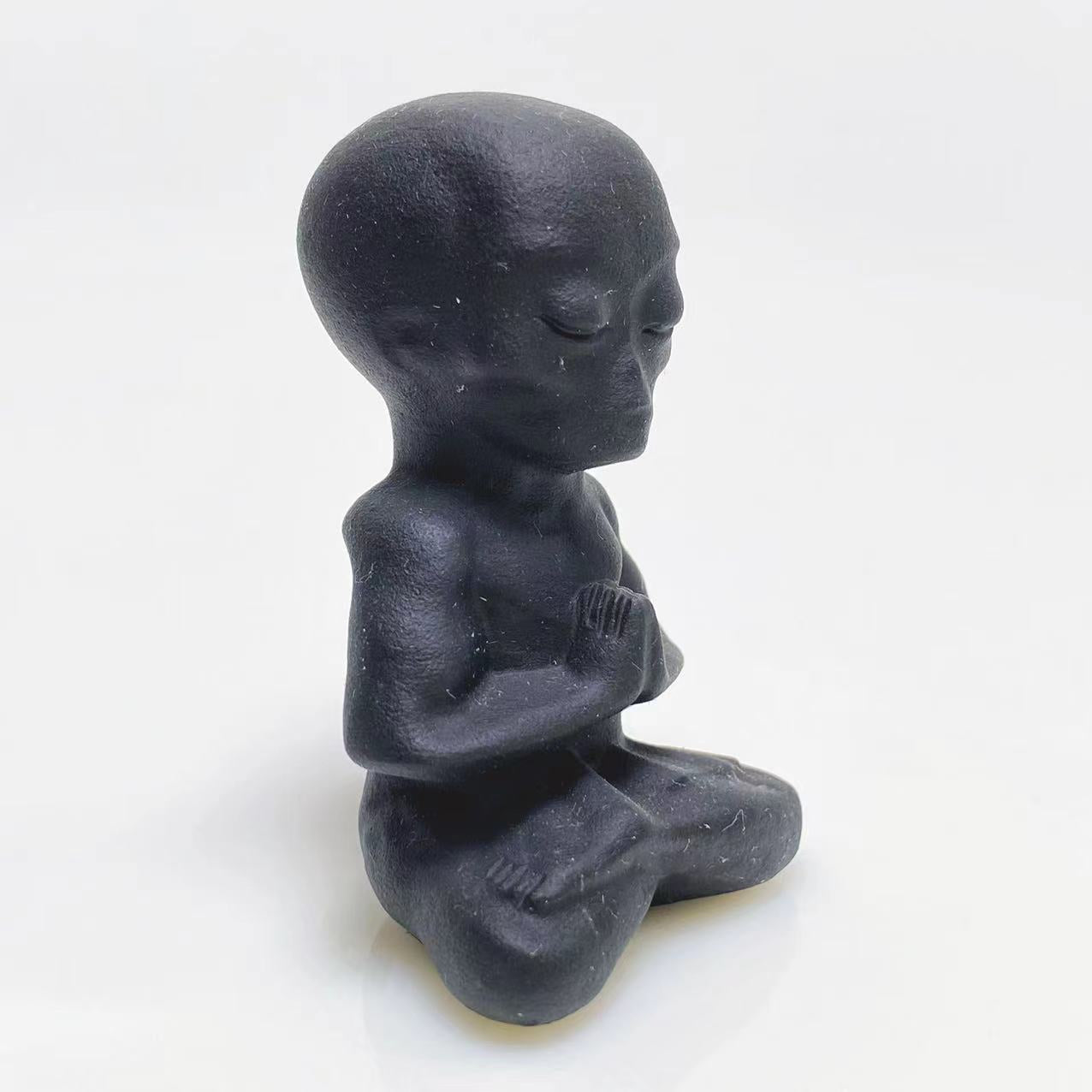Black obsidian yoga alien carving