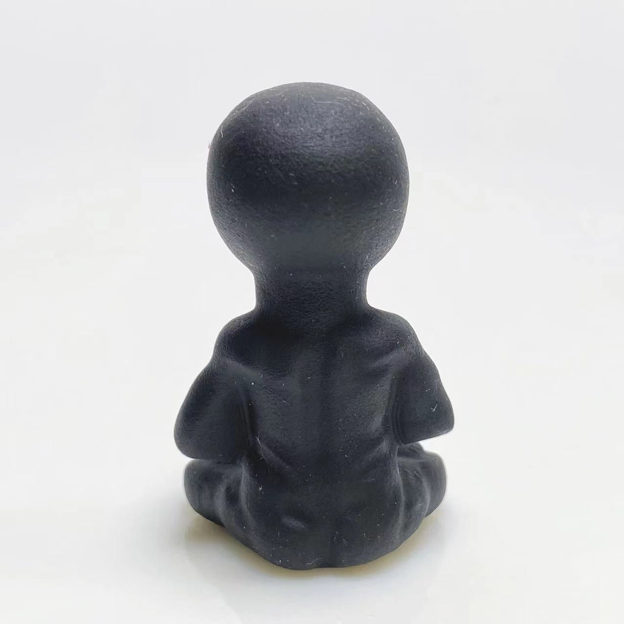 Black obsidian yoga alien carving