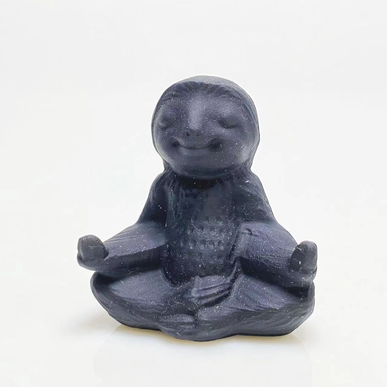 Black obsidian yoga ottter carving