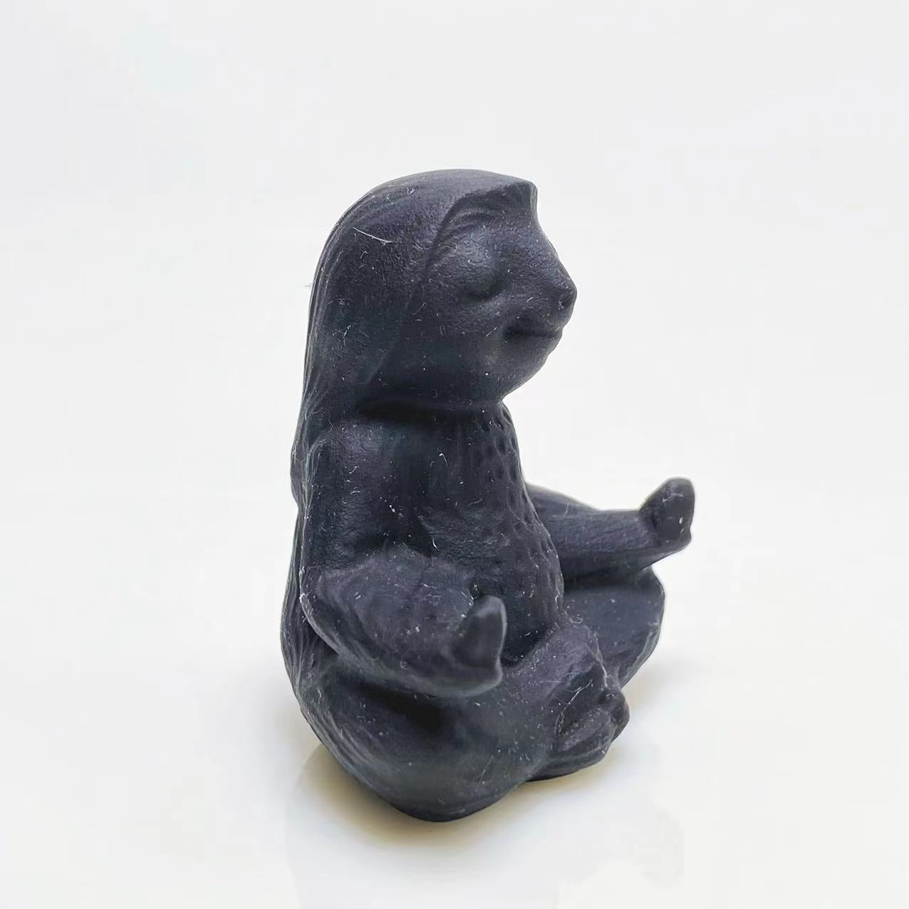 Black obsidian yoga ottter carving