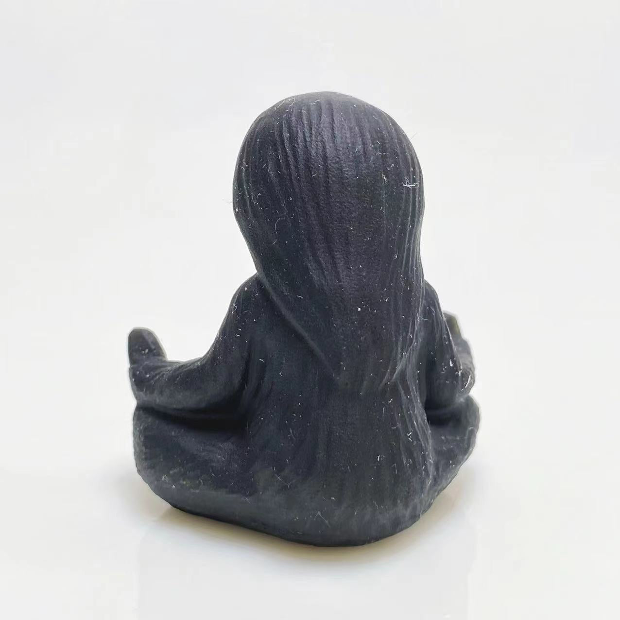 Black obsidian yoga ottter carving