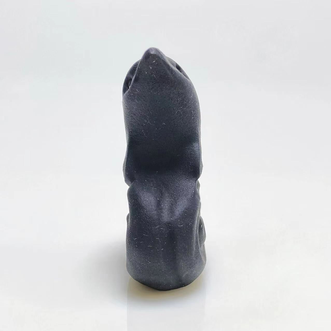 Black obsidian dolphin carving