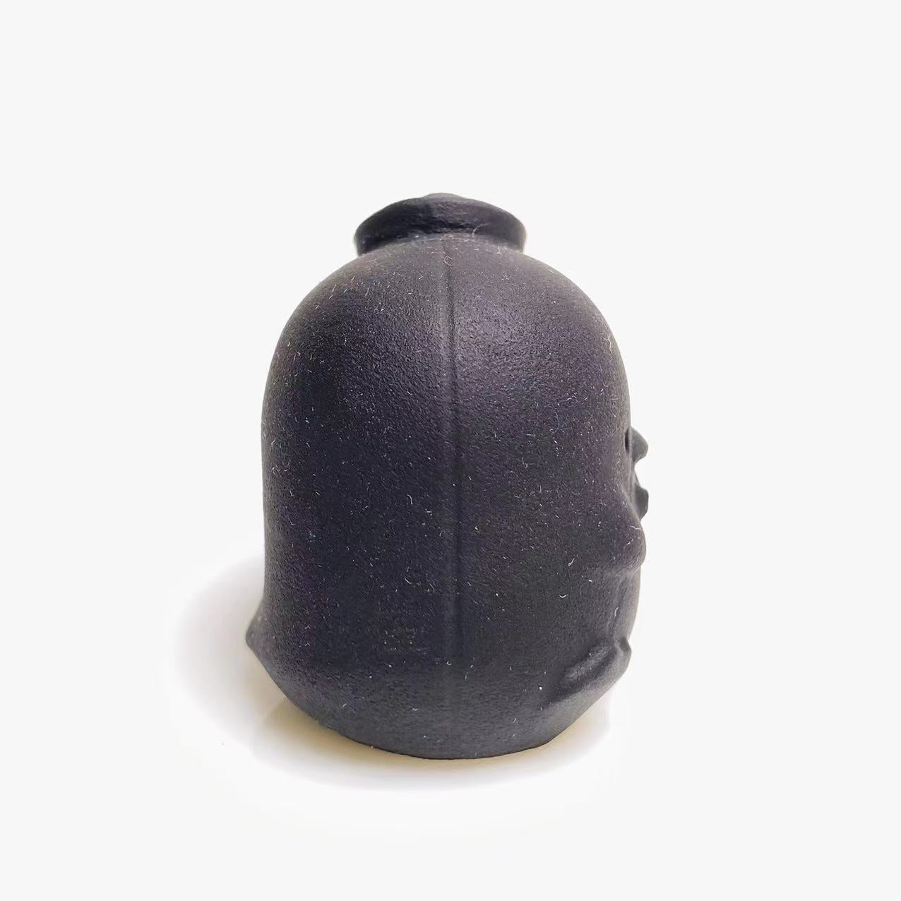 Black obsidian chick carving