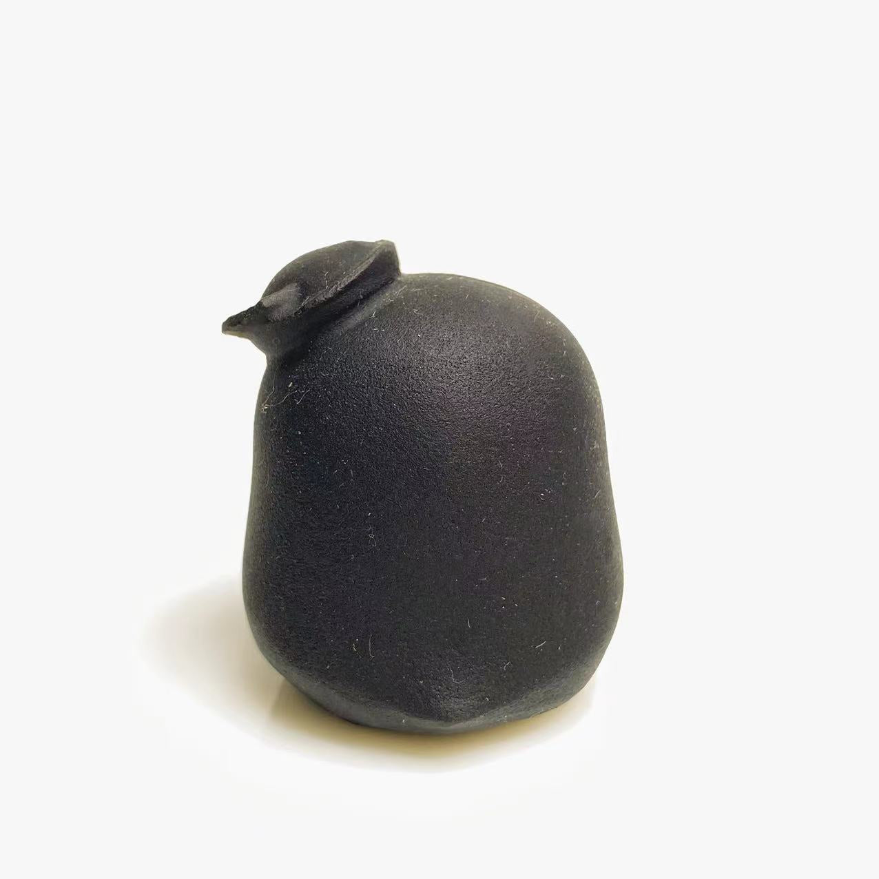 Black obsidian chick carving