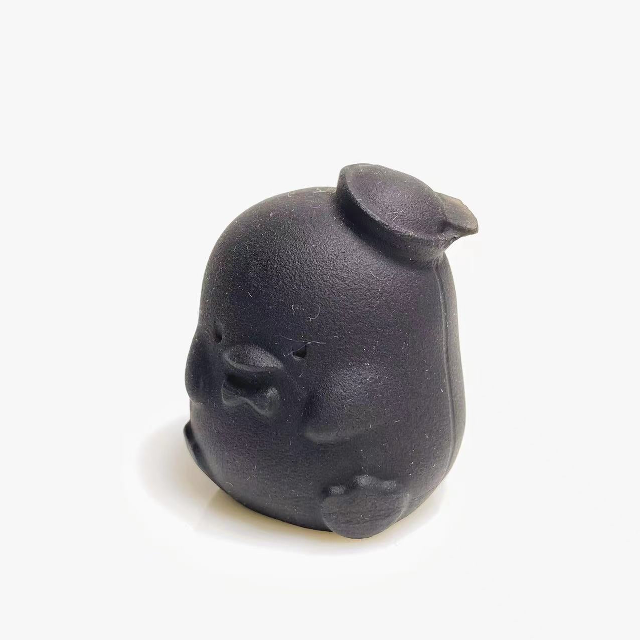 Black obsidian chick carving