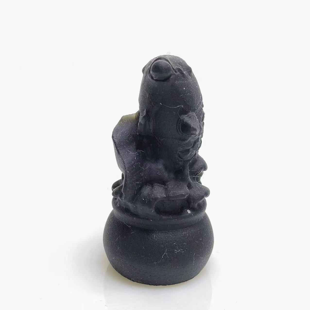 Black obsidian fish carving