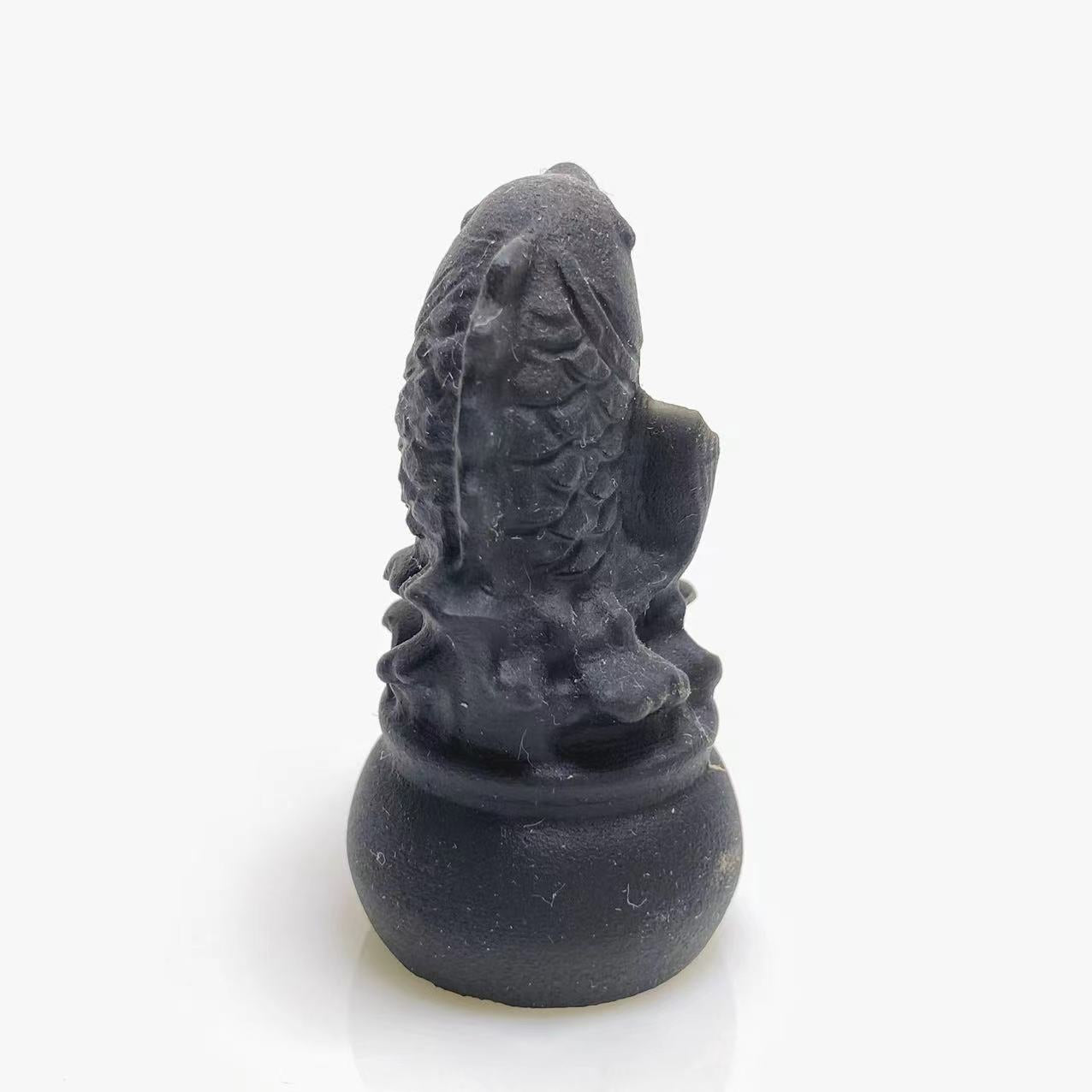 Black obsidian fish carving