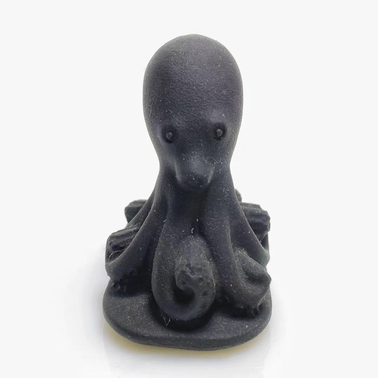 Black obsidian octopus carving