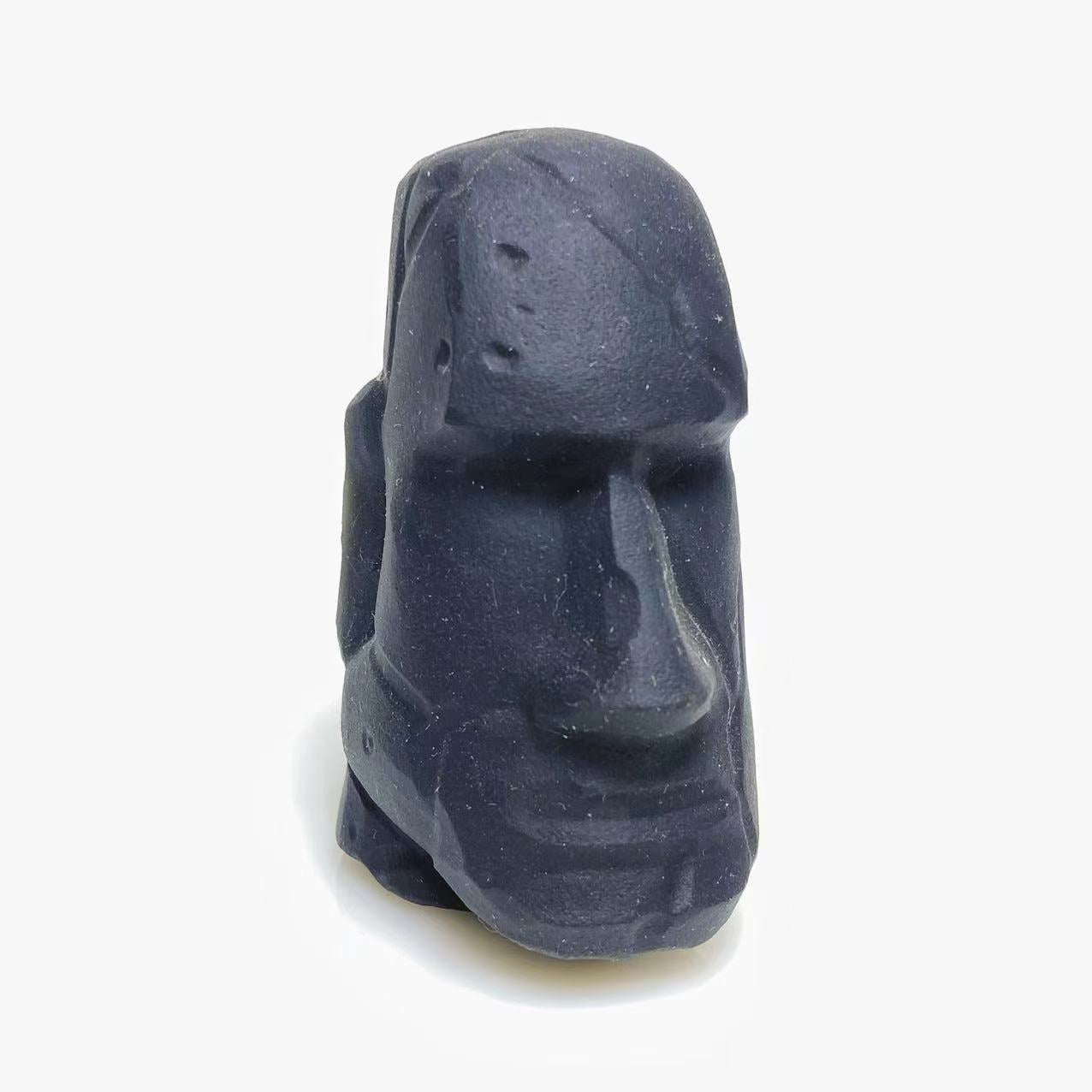 Black obsidian stone face carving