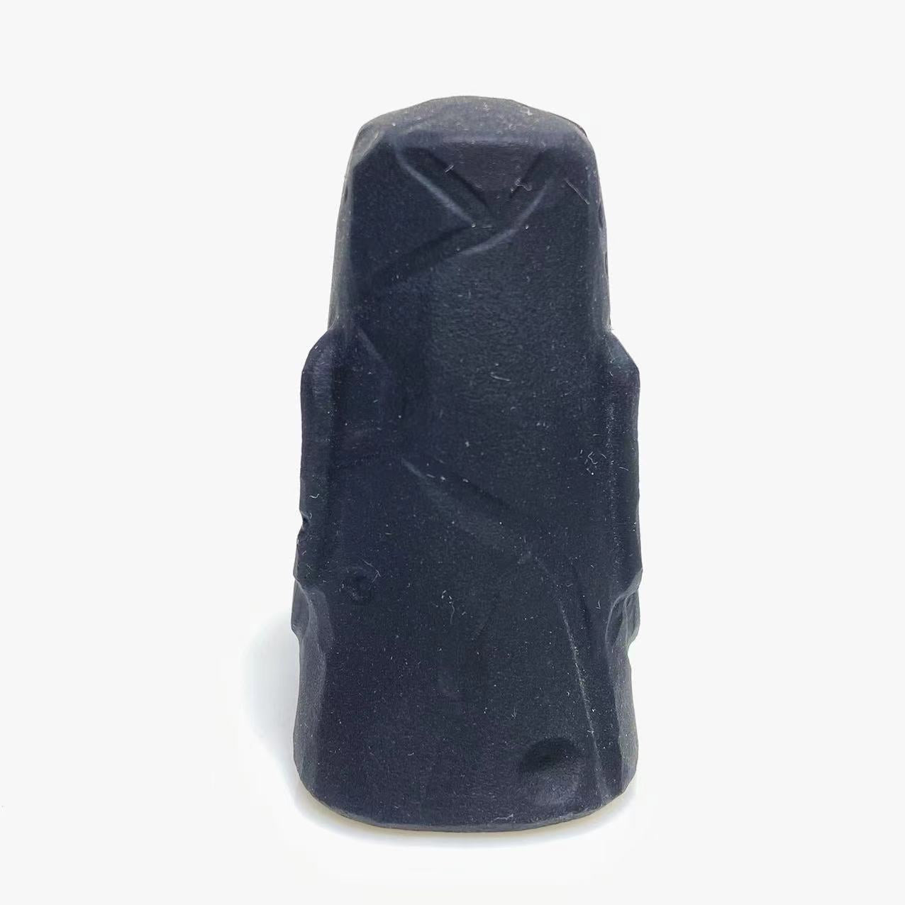 Black obsidian stone face carving