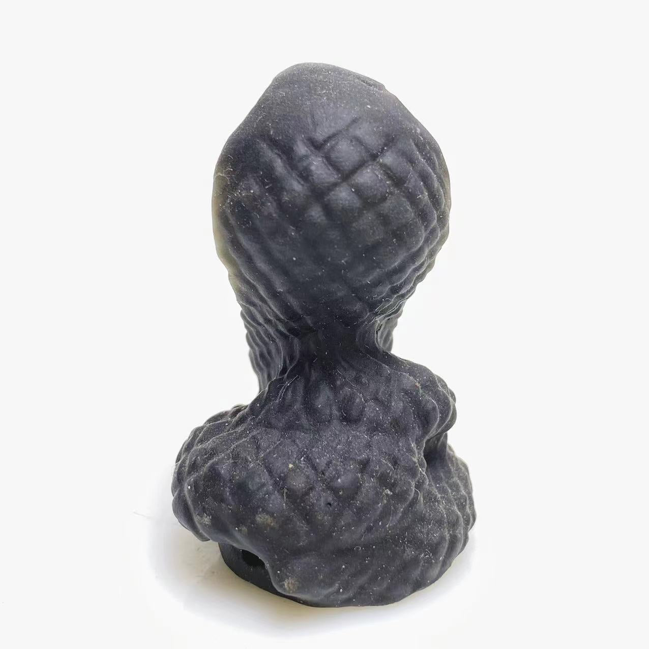 Black obsidian snake carving