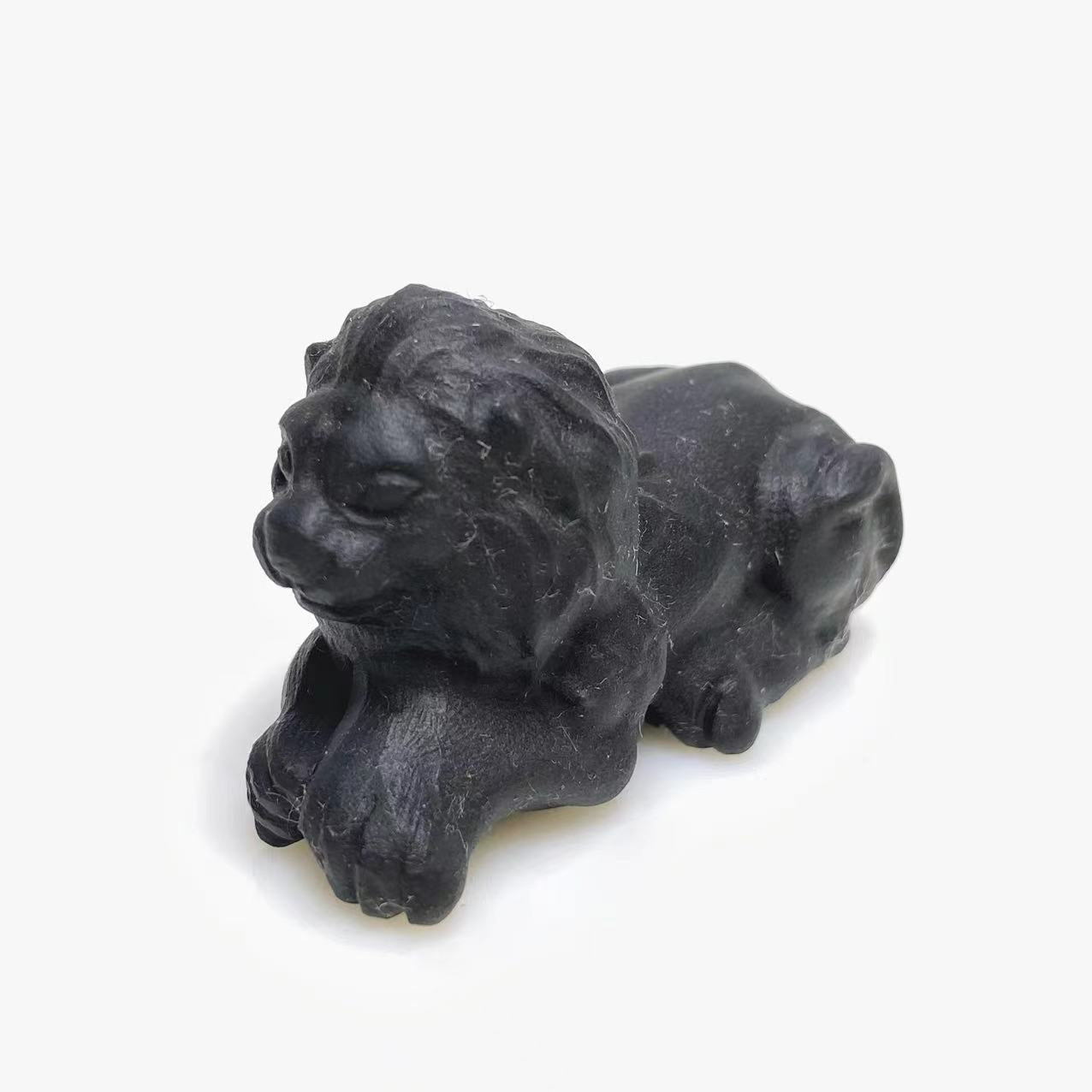 Black obsidian lion carving