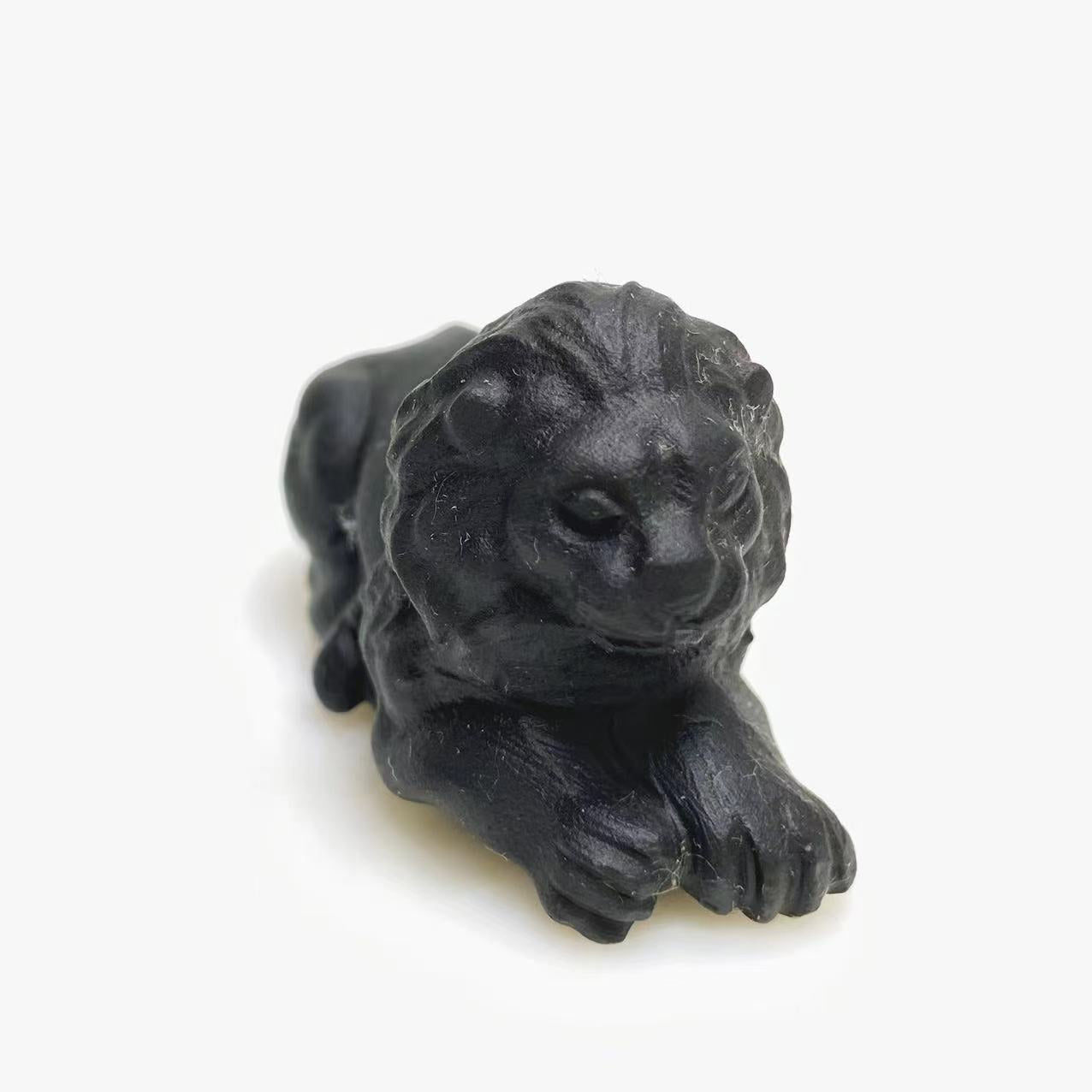 Black obsidian lion carving