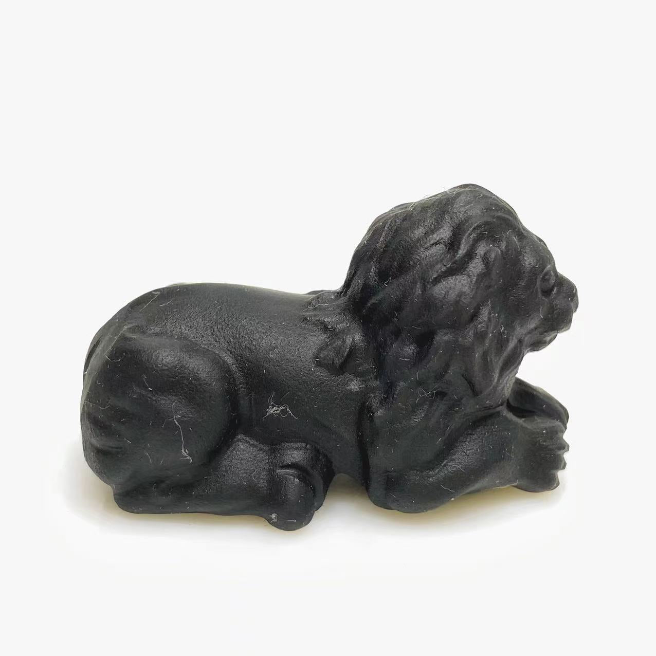 Black obsidian lion carving