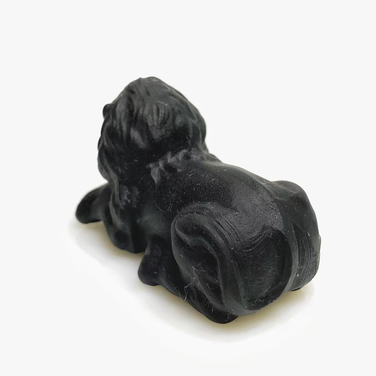Black obsidian lion carving