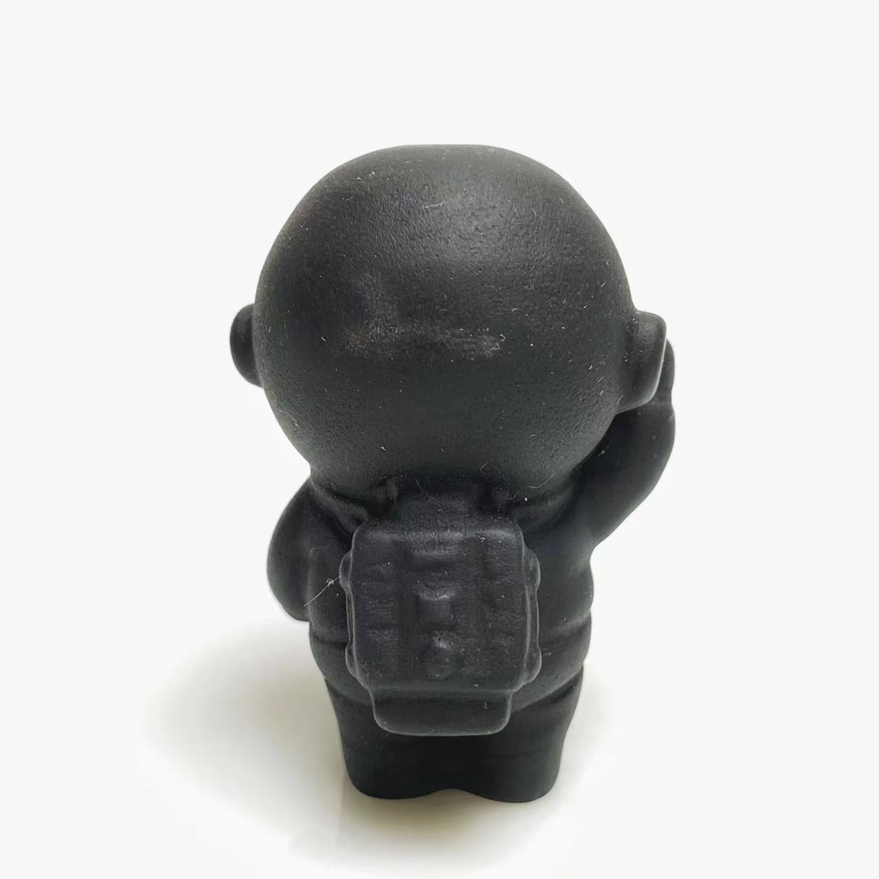Black obsidian spaceman carving