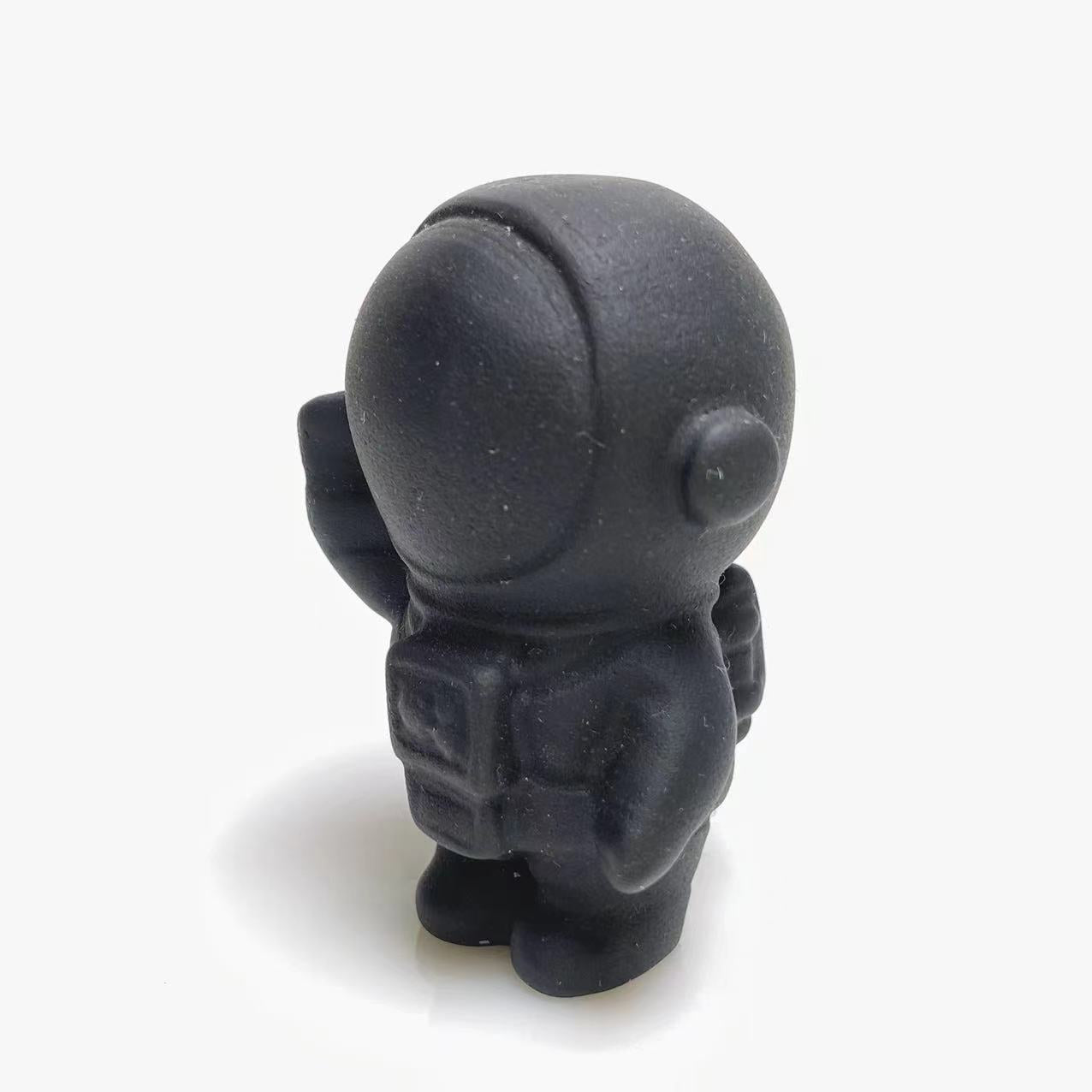 Black obsidian spaceman carving