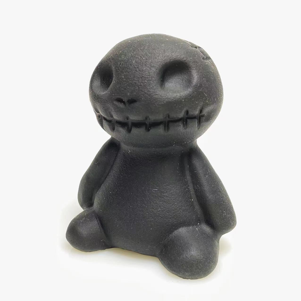 Black obsidian toy carving