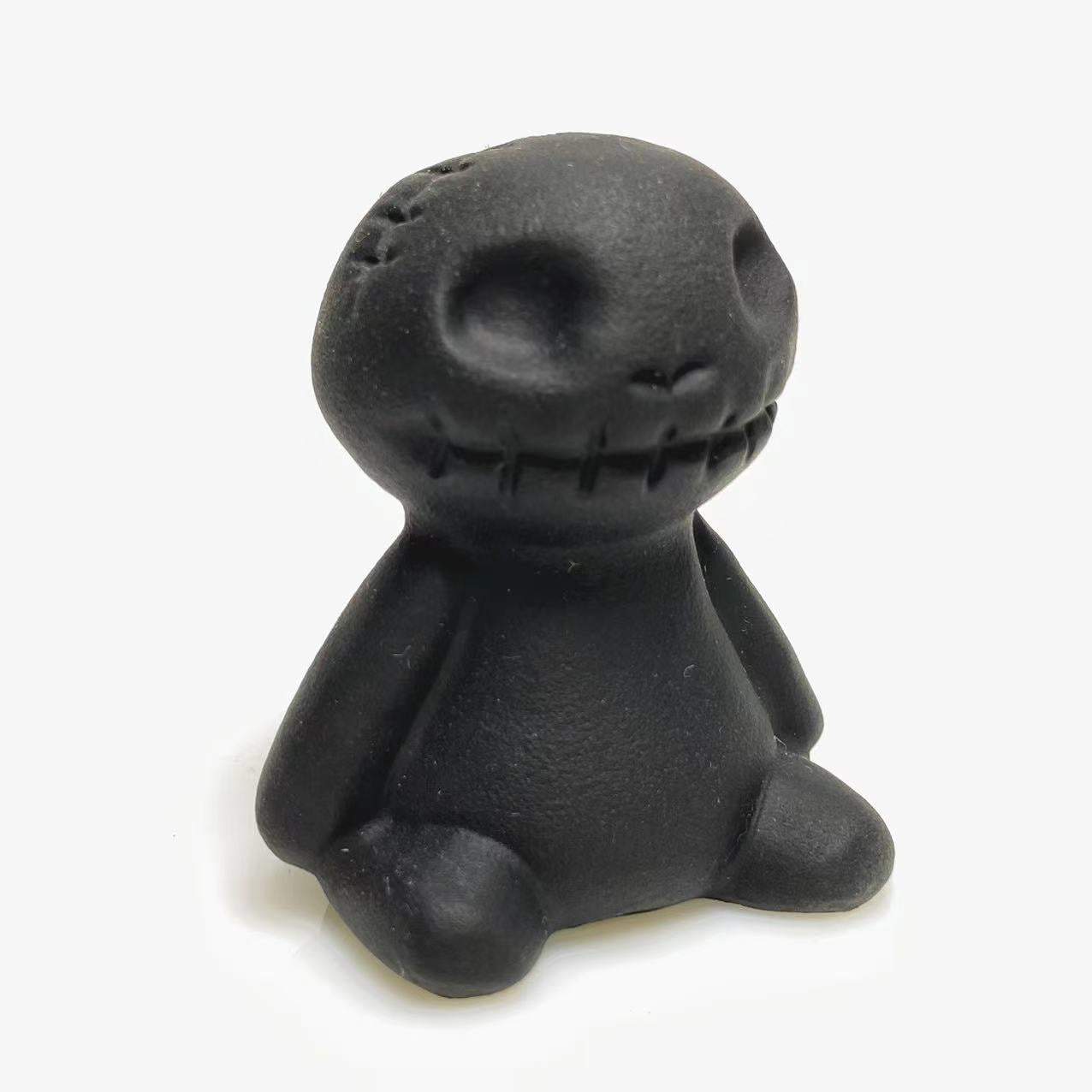 Black obsidian toy carving