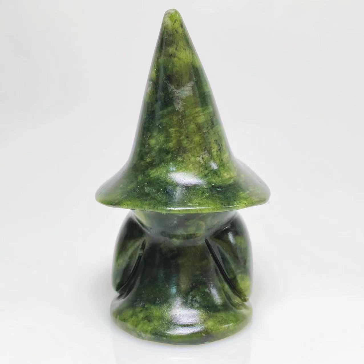 Green jade ghost with witch hat carving