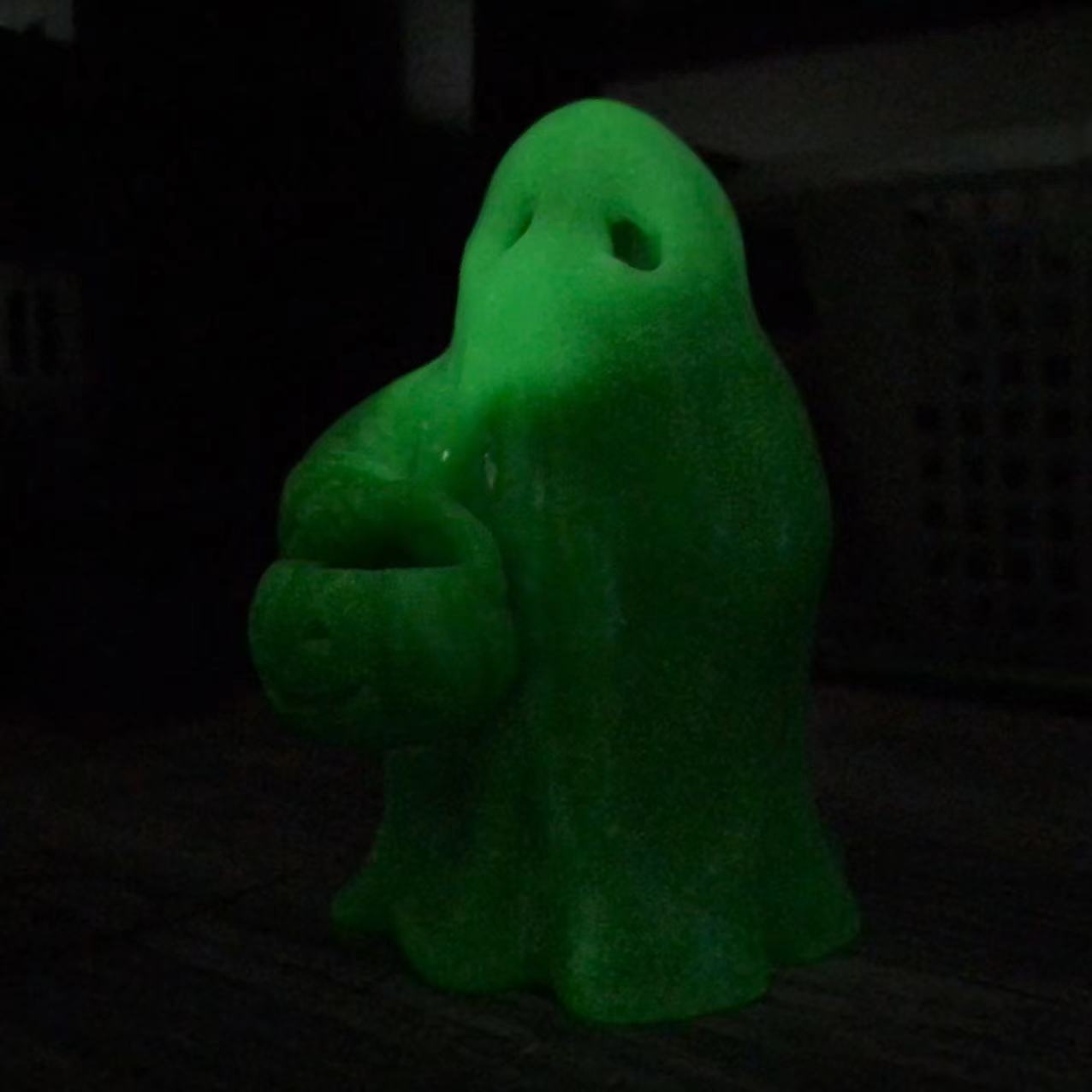 Luminous ghost with pumpkin carving
