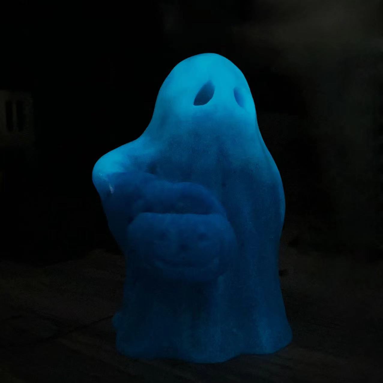 Luminous ghost with pumpkin carving