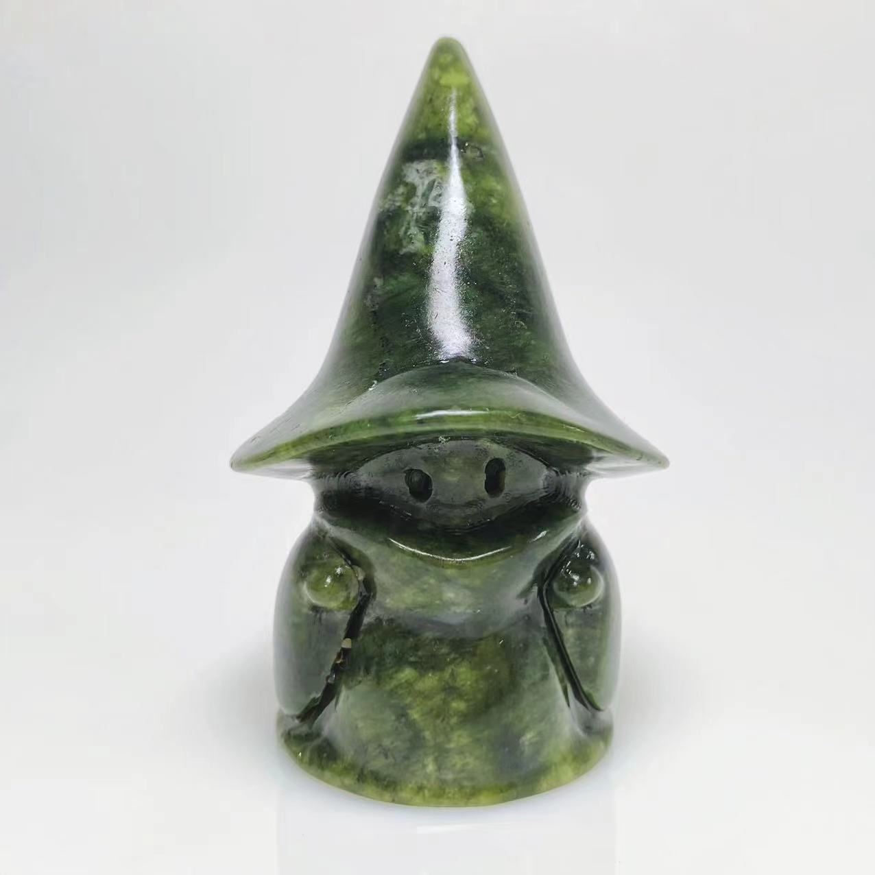 Green jade ghost with witch hat carving