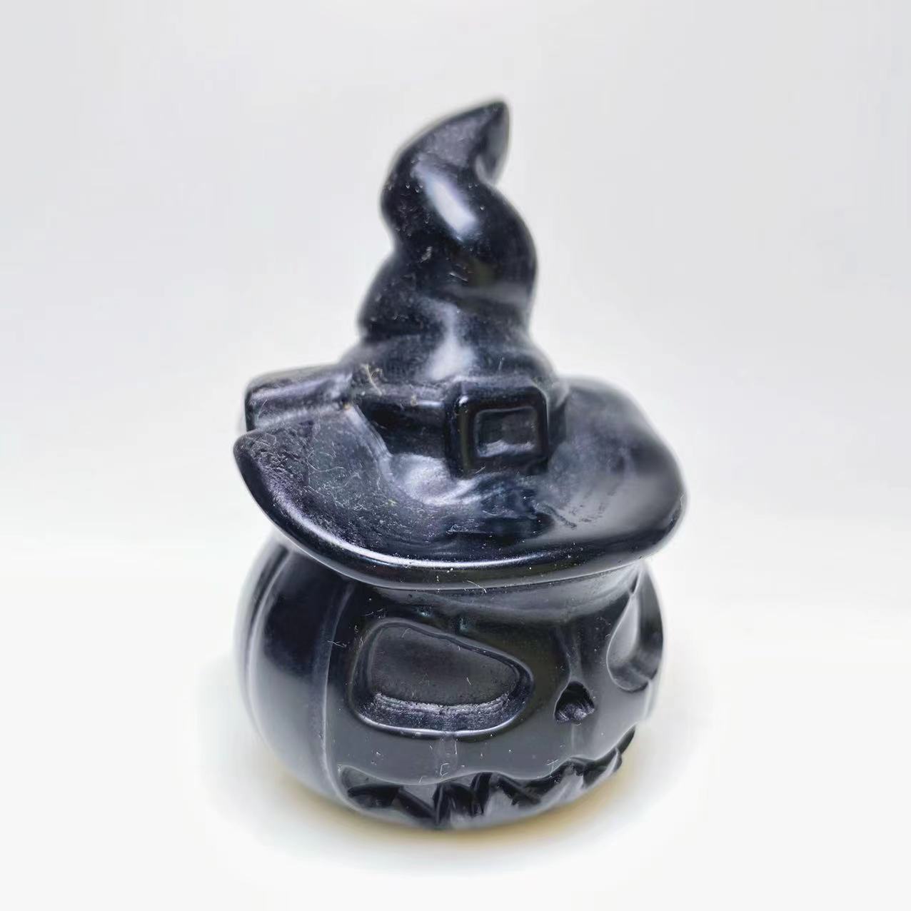 Halloween pumpkin with witch's hat carvings