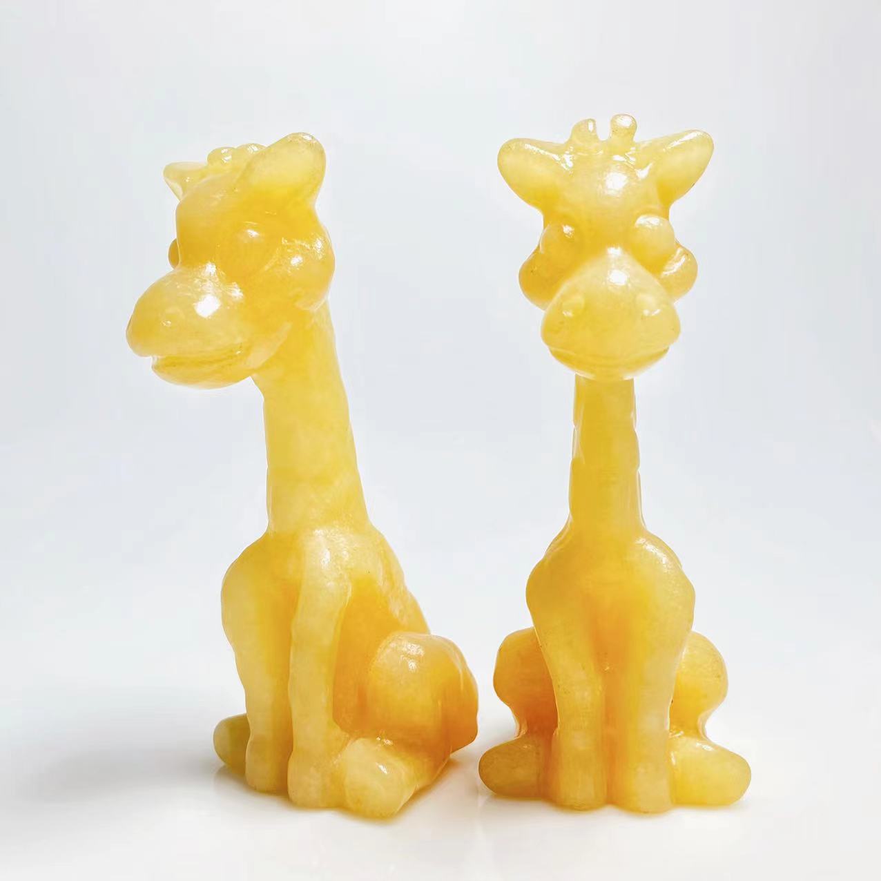 Yellow calcite giraffe carving