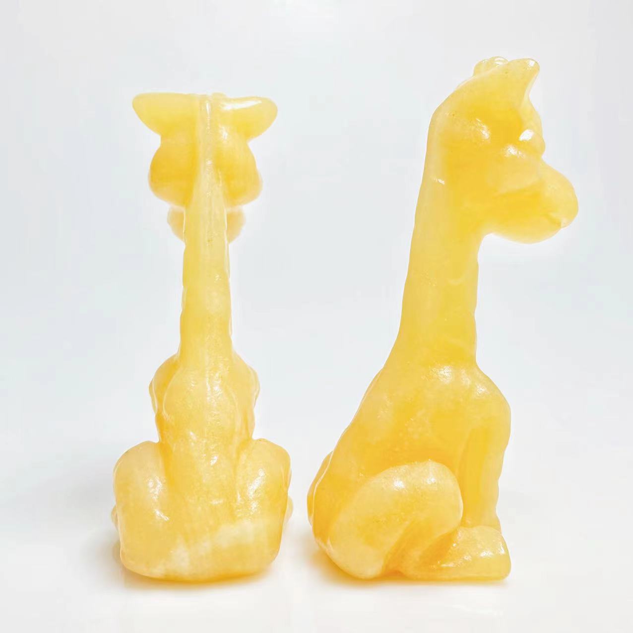 Yellow calcite giraffe carving
