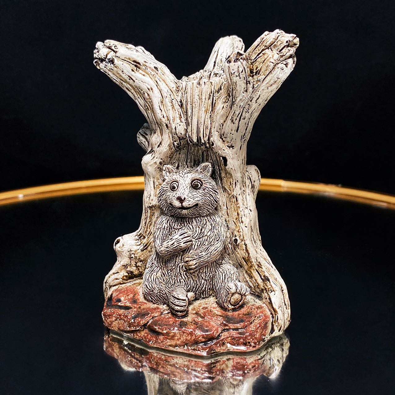 Resin bear with tree sphere stand