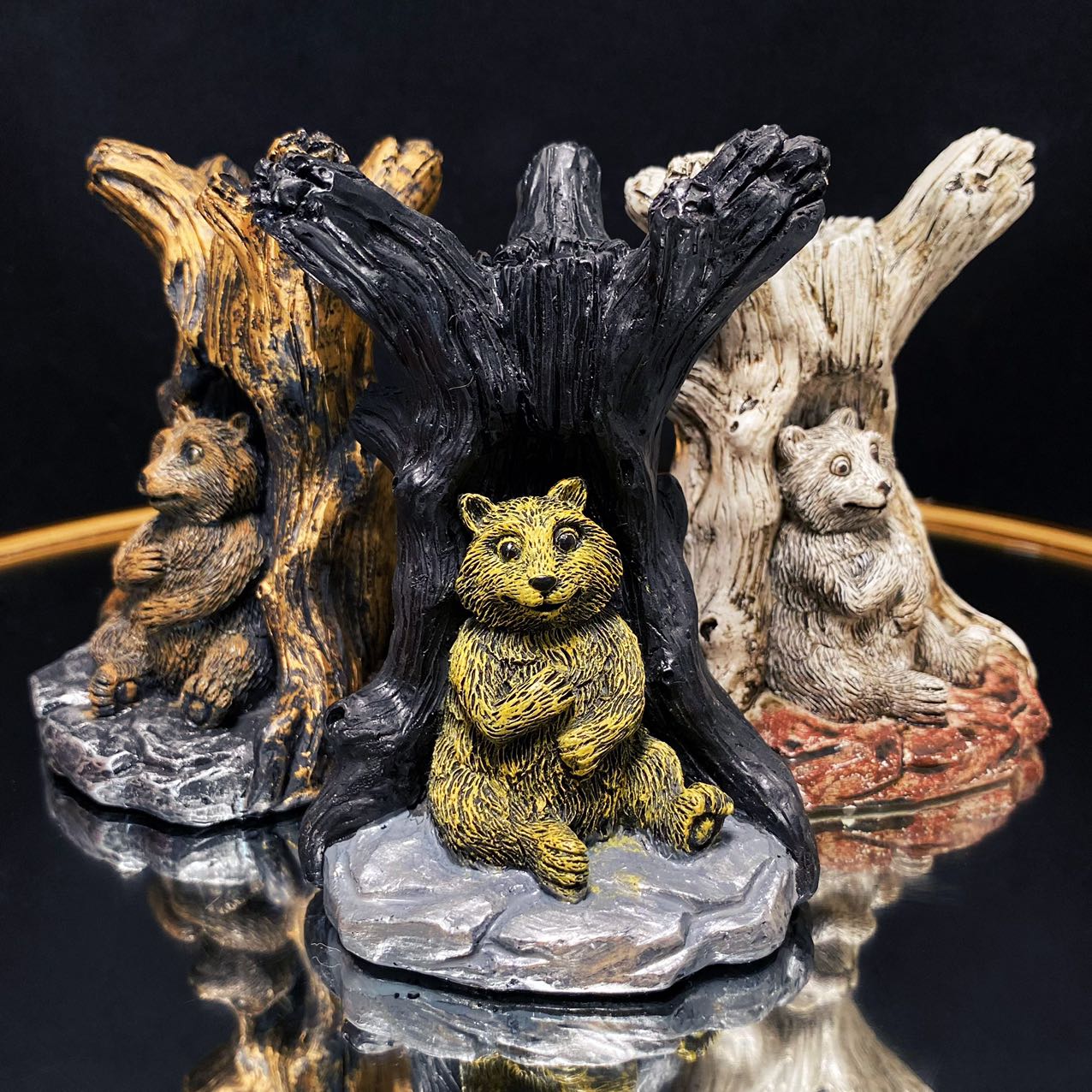 Resin bear with tree sphere stand