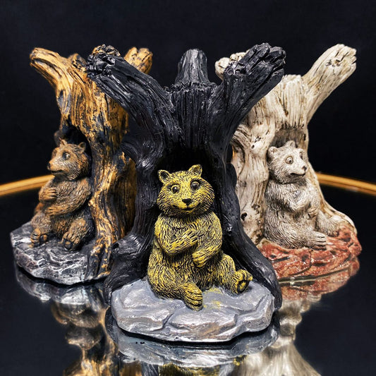 Resin bear with tree sphere stand