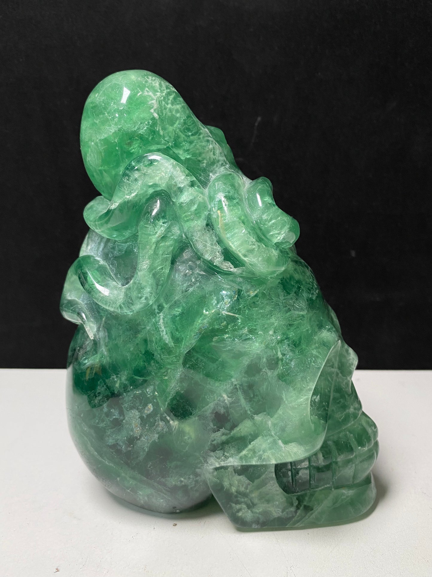 Green fluorite octopus on skull carving#2594