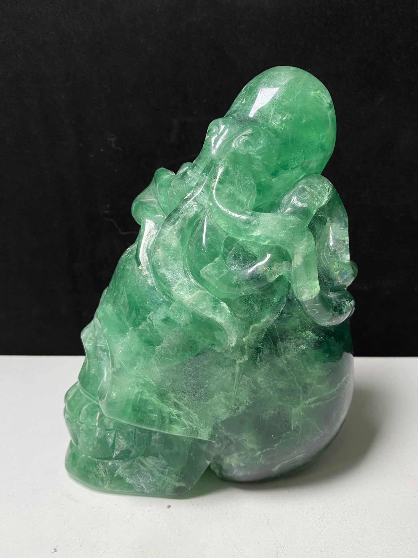 Green fluorite octopus on skull carving#2594