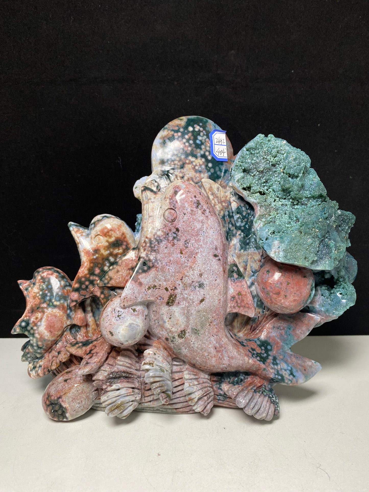 053-Ocean jasper with circles three dolphins carving #2692