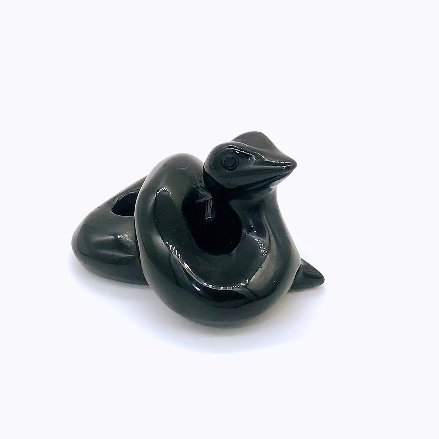 Crystal snake carvings of different materials