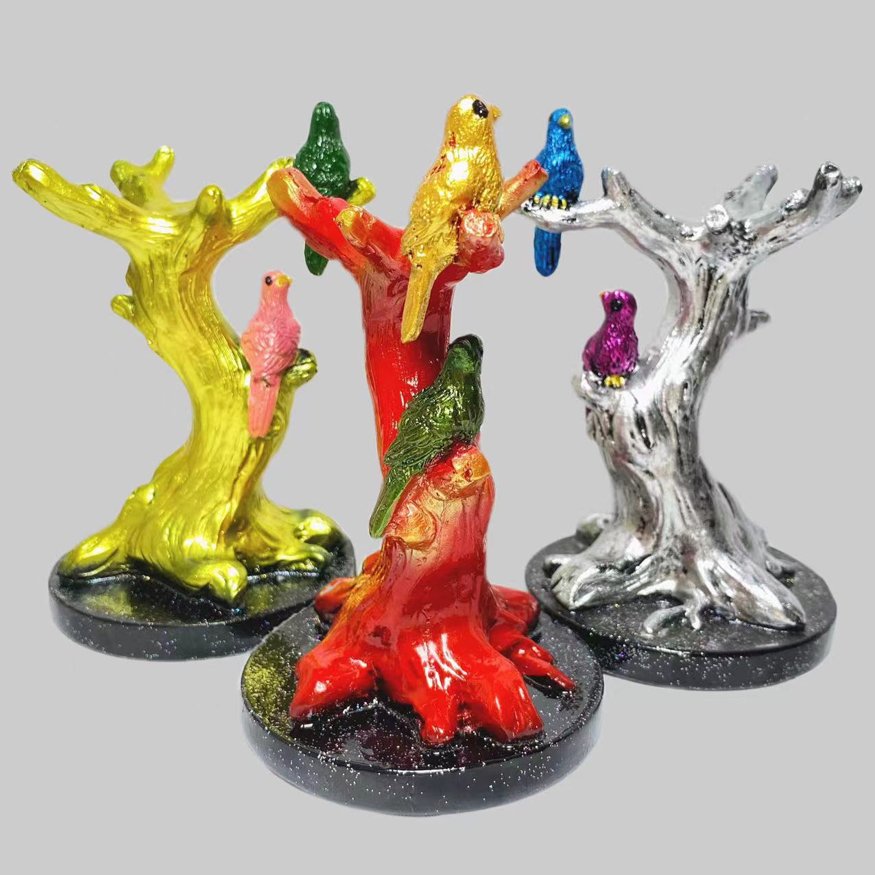 Resin birds on tee sphere stand