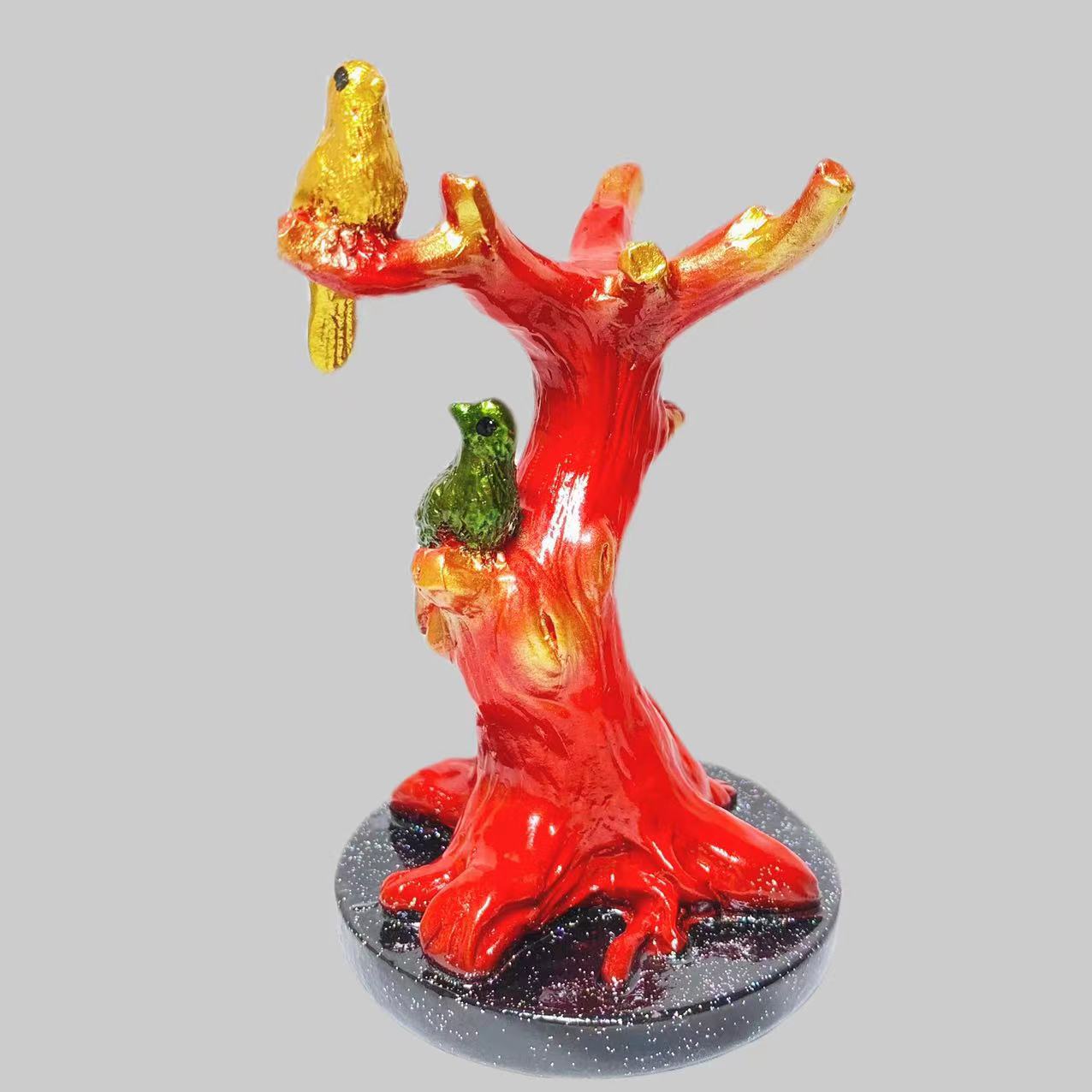 Resin birds on tee sphere stand